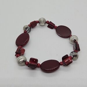 red and silver tone shell beaded stretch bracelet